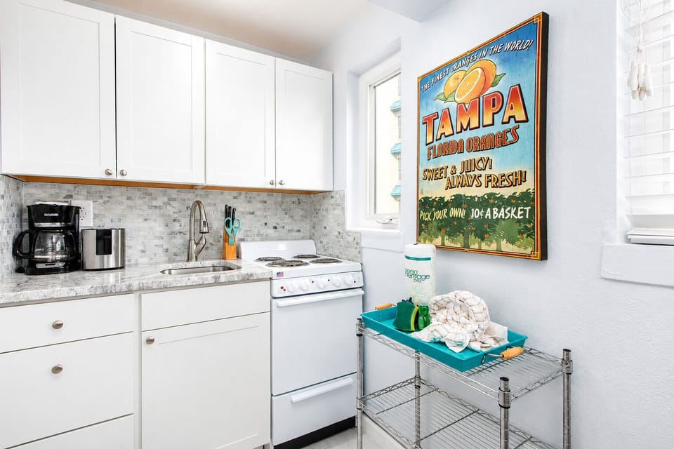 The kitchen is equipped with basics for convenience, including a refrigerator, stove/oven, microwave, toaster, and a Keurig & regular drip coffee maker — everything you need for easy meals during your stay.