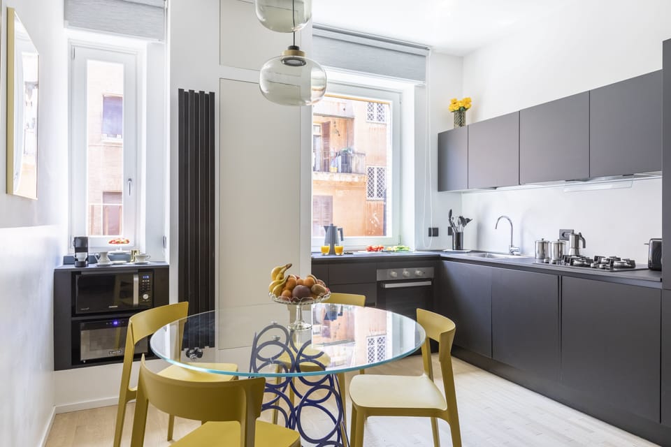 Deluxe Apartment | Living area | 50-inch flat-screen TV with satellite channels, TV, DVD player