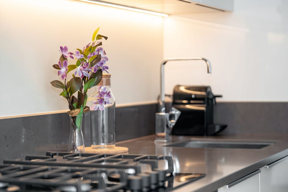 Comfort Apartment | Private kitchen | Electric kettle, highchair, cookware/dishes/utensils, dining tables