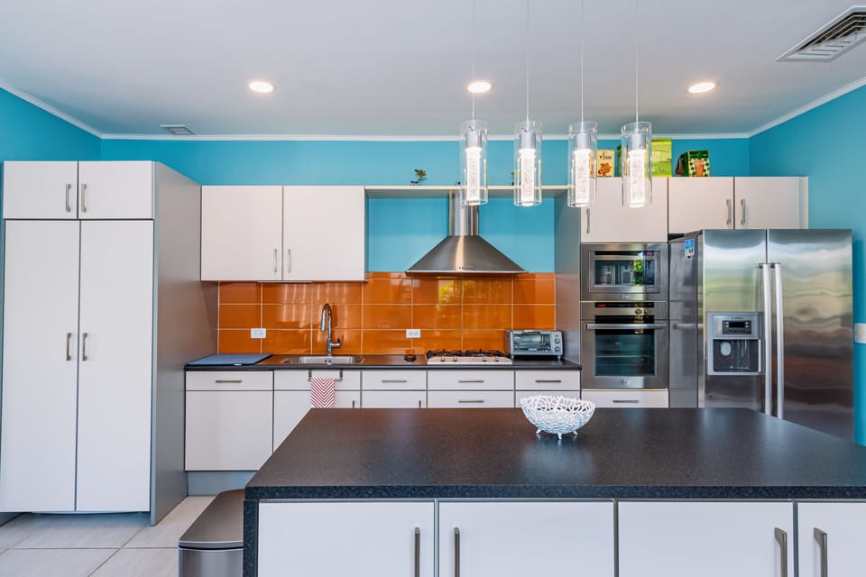 Discover our fully equipped kitchen, where culinary adventures await with modern amenities for your convenience and enjoyment.