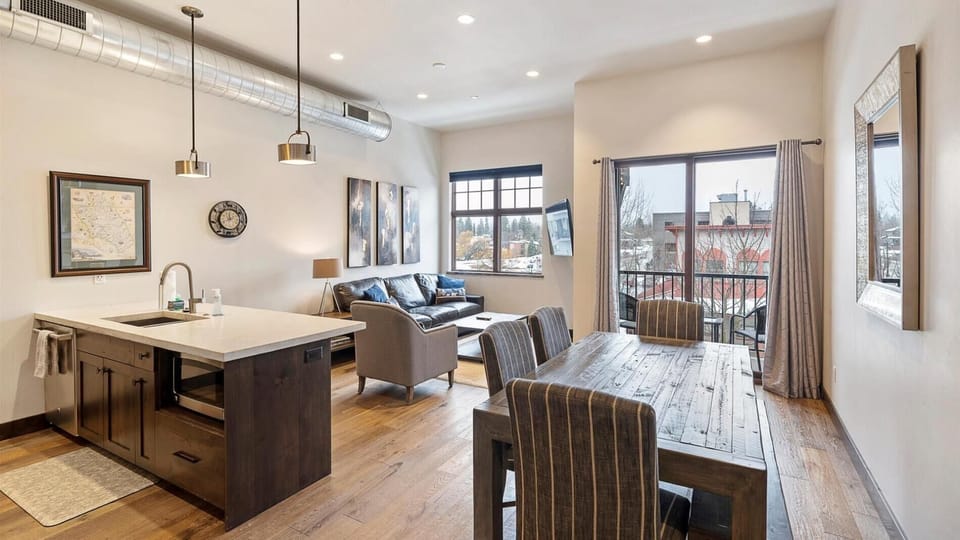 Open concept living room, dining room, and kitchen