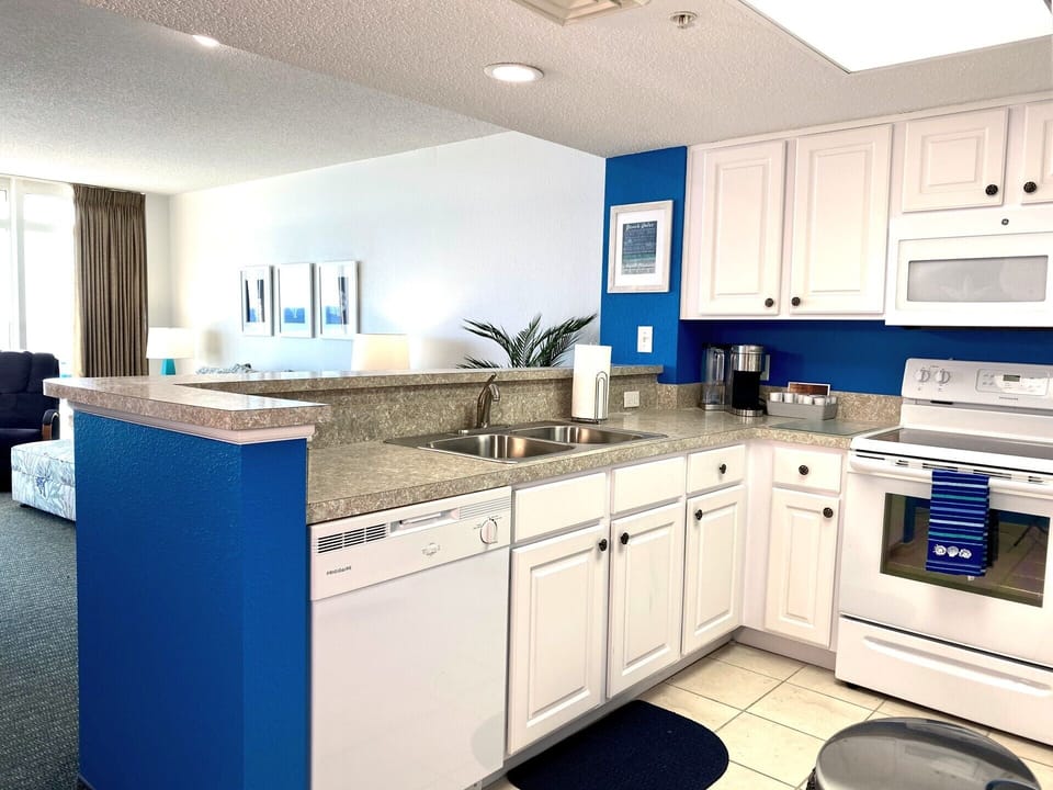 Full kitchen with dishwasher, range, microwave, refrig, Keurig, pots/pans, etc.