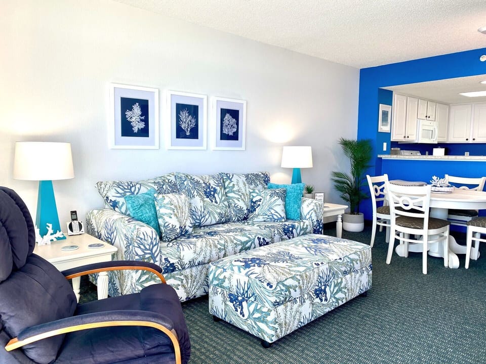 The oceanfront living room is well-appointed with updated furnishings.