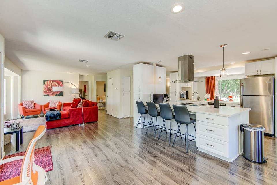 Remodeled Kitchen with Updated Stainless Steel Appliances and Bar Seating for Four
