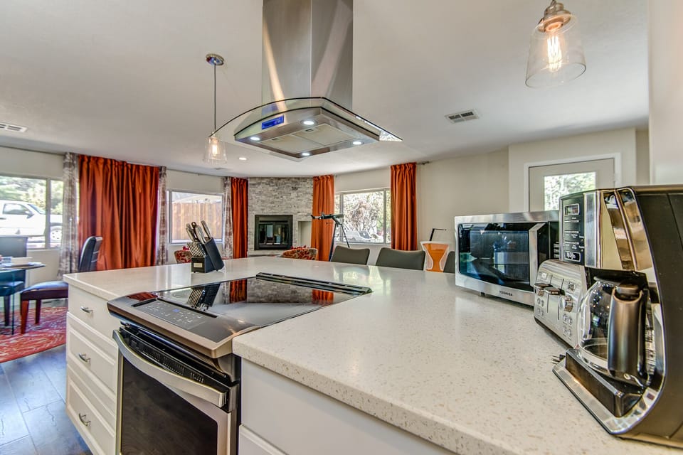 Stone Countertops and an Electric Range in the Kitchen Island