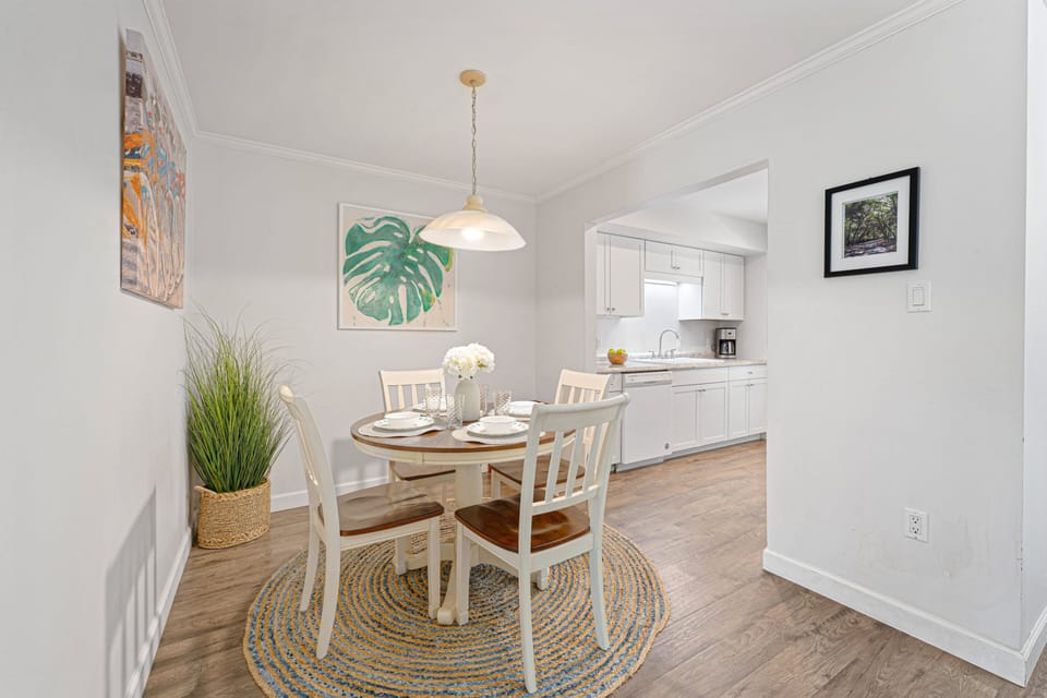 Charming dining nook designed for easy island living. This inviting space seats four comfortably—perfect for morning coffee and casual lunches.