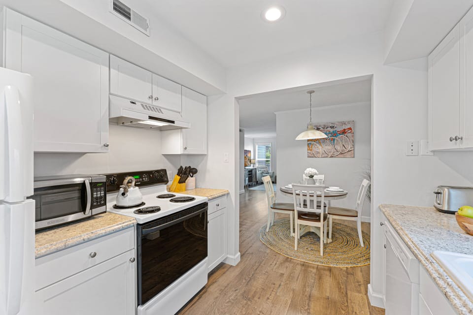 Updated kitchen is designed to make vacation living easy, with counter space, modern appliances, and everything needed to prepare meals