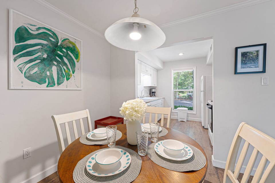 Positioned between the kitchen and living room, this inviting space keeps everyone connected.