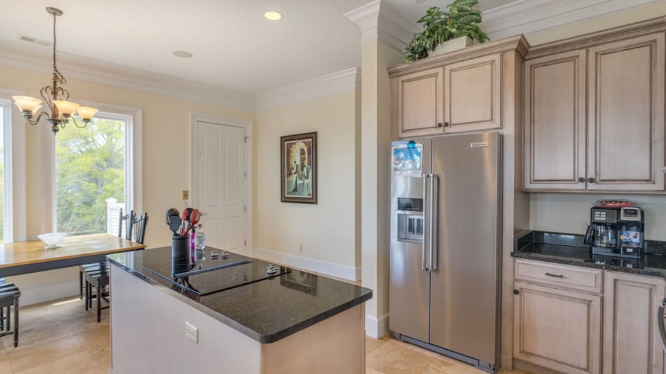 Views of the pool and outdoor living spaces enhance the warm, inviting atmosphere.