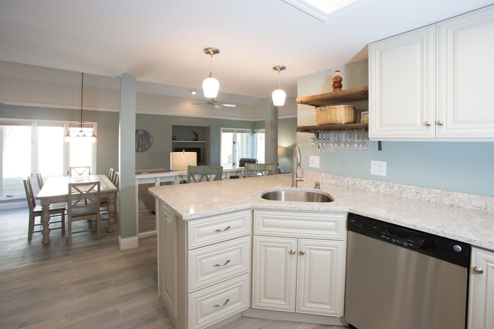 This bright, functional kitchen offers ample cabinet storage, a full suite of appliances and a generous peninsula that expands your prep space.