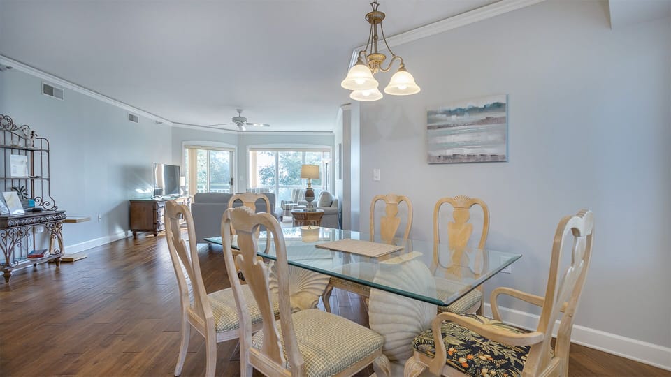 Large windows at the far end bring in natural light and tranquil views, keeping the space bright and welcoming.
