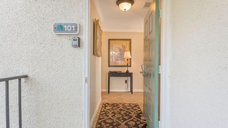 A welcoming entry sets the tone as you step inside, featuring a tiled foyer with soft coastal colors and classic finishes.