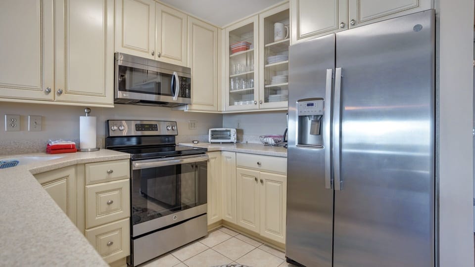 Stainless steel appliances add a polished touch, while the open layout keeps the kitchen connected to the rest of the living space