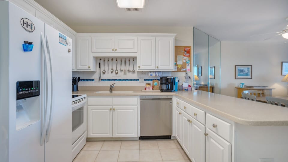 The layout flows seamlessly into the dining and living areas, making it simple to cook, gather, and stay connected