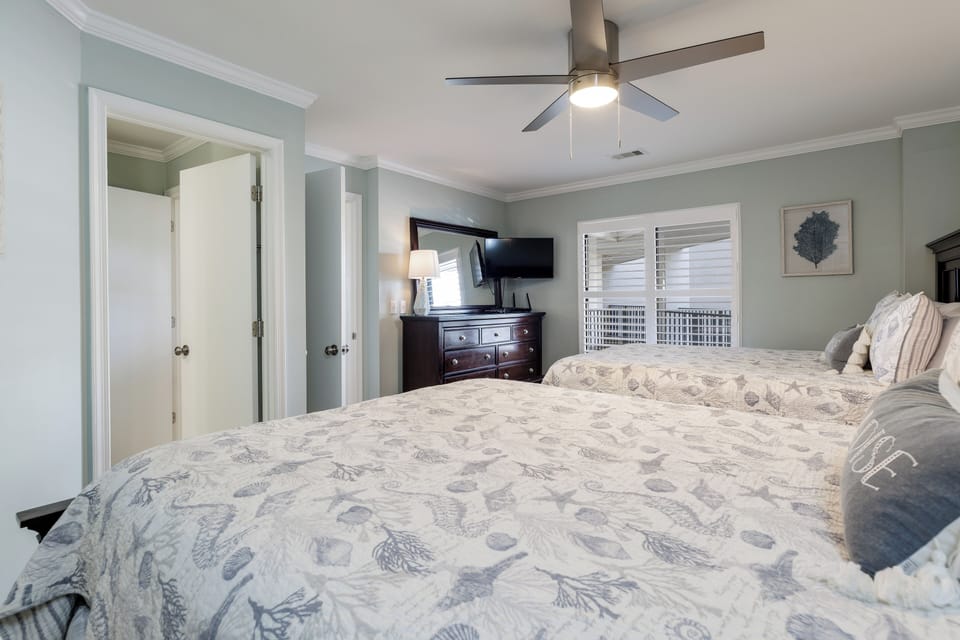 Dual closets provide excellent storage, and a modern ceiling fan adds comfort and style—an ideal space for family or guests to unwind.
