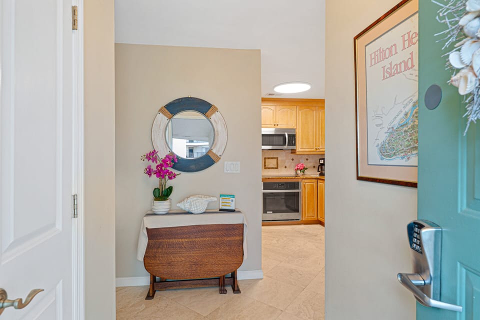 The welcoming entry foyer sets the tone for a relaxing coastal getaway.