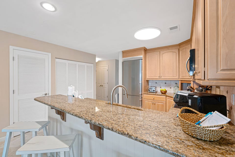 The oversized breakfast bar provides additional seating and keeps the kitchen connected to the dining and living areas, making it easy to gather