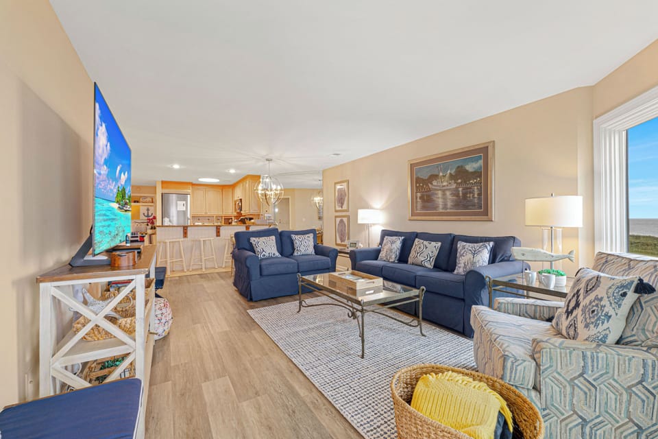 The living room flows seamlessly into the dining area and kitchen, making it easy to stay connected.