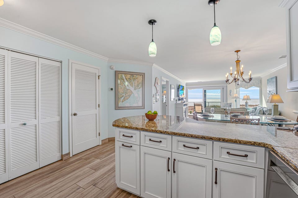 This bright, functional kitchen offers ample cabinet storage, a full suite of appliances, and a generous peninsula that expands your prep space.