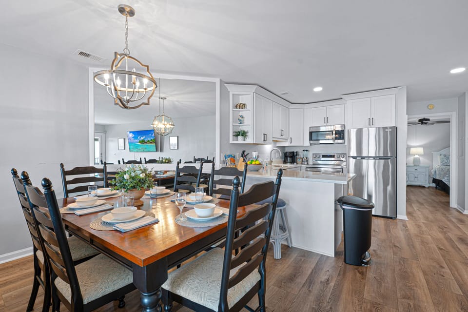 Area is arranged for easy conversation and movie nights, while the open staircase adds architectural interest without interrupting the sightlines.