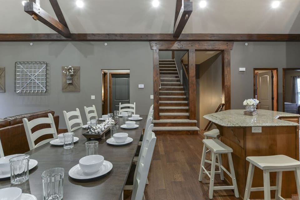 Dining with stairway to upper level.