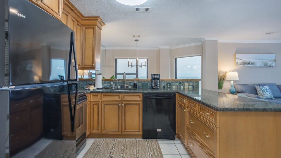 This open kitchen and breakfast bar create an easy, welcoming hub for everyday living and entertaining.