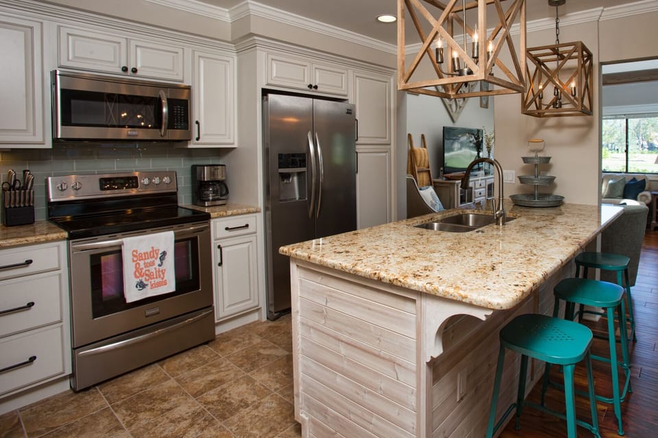 Statement pendant lighting adds character, and the open layout flows easily into the living area—ideal for gathering, cooking, and staying connected during your stay.