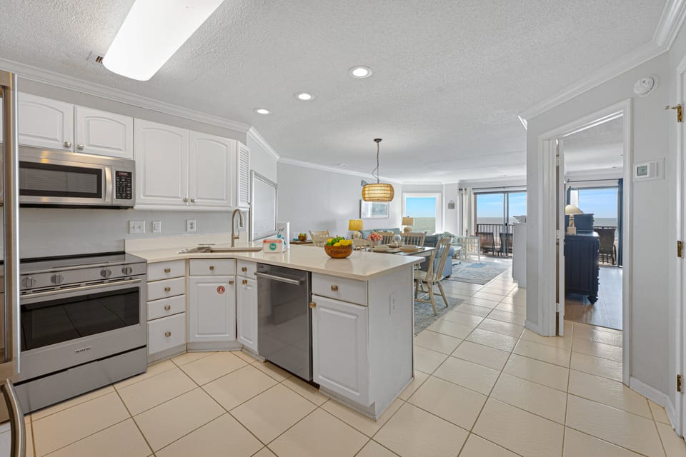 The kitchen opens seamlessly into the dining and living areas, creating a bright, connected space designed for easy gathering.