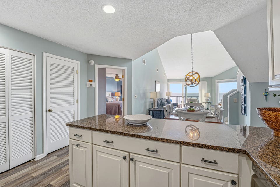 A spacious peninsula offers additional seating and prep room, ideal for casual dining or entertaining.