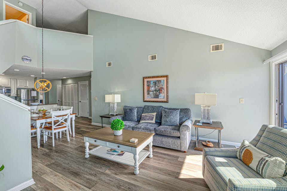 The layout flows effortlessly into the dining area and renovated kitchen, making this the perfect gathering spot for family and friends.