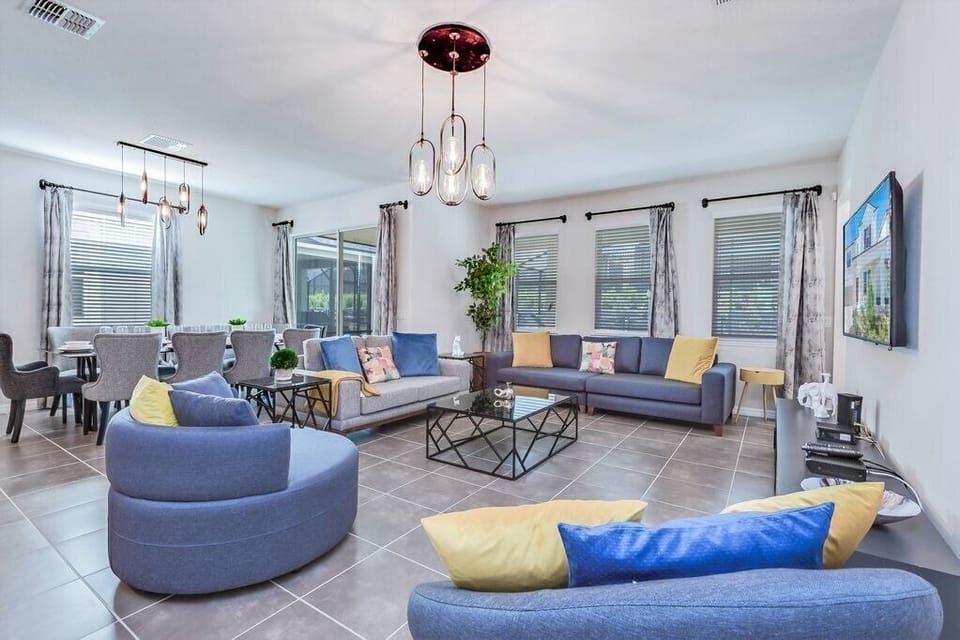 Beautiful living room with spacious seating and flat screen TV