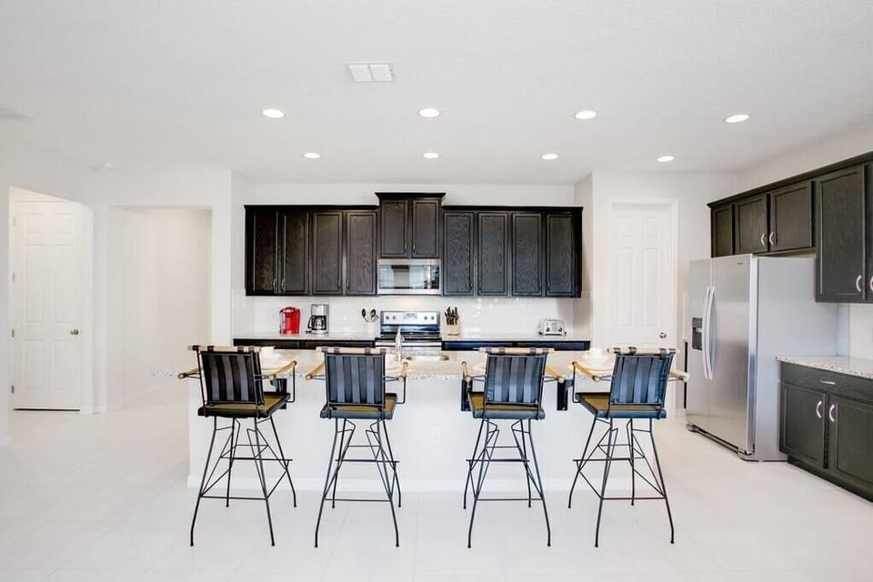 Extravagant kitchen with large island and seating