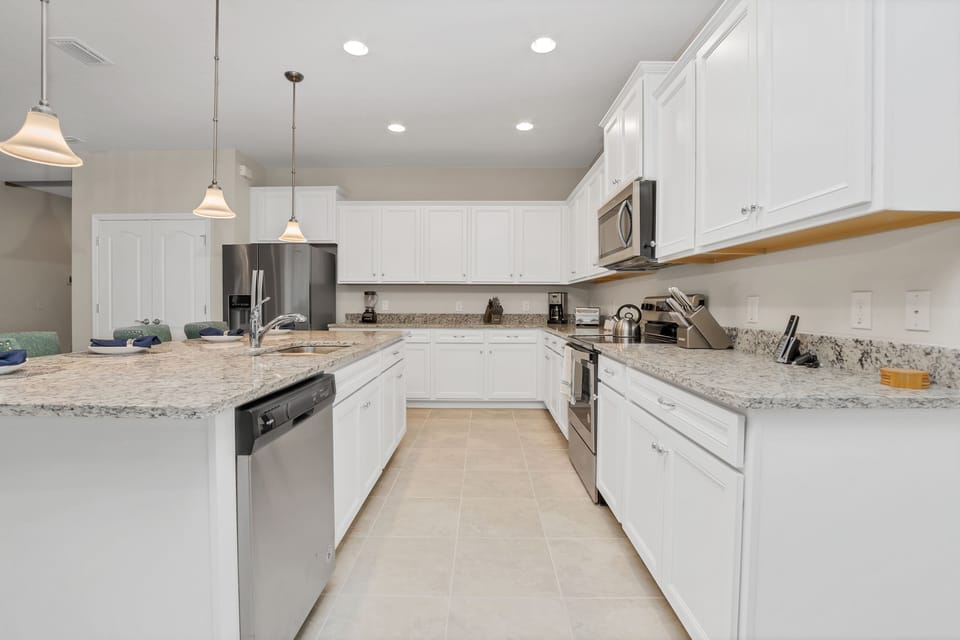 Gorgeous kitchen with blender, coffee machine, and kettle