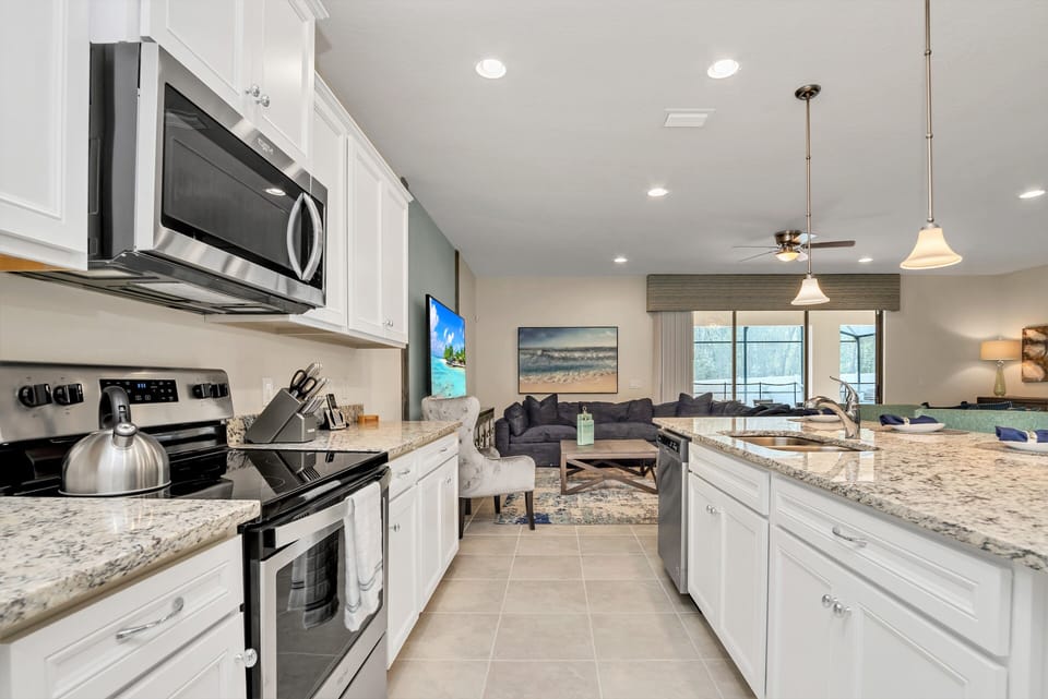 View 2 of gorgeous kitchen with blender, coffee machine, and kettle