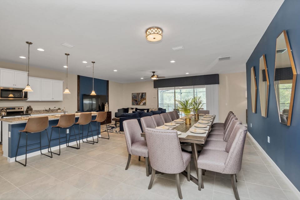 Spacious downstairs area with dining table and barstool seating