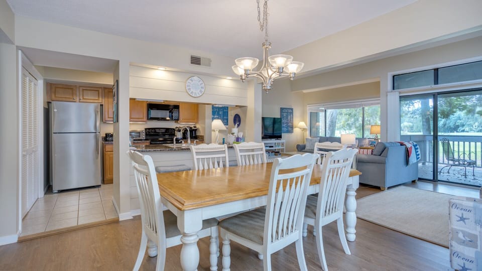 Positioned just off the kitchen, it's a convenient and comfortable spot for shared meals, game nights, and vacation memories.