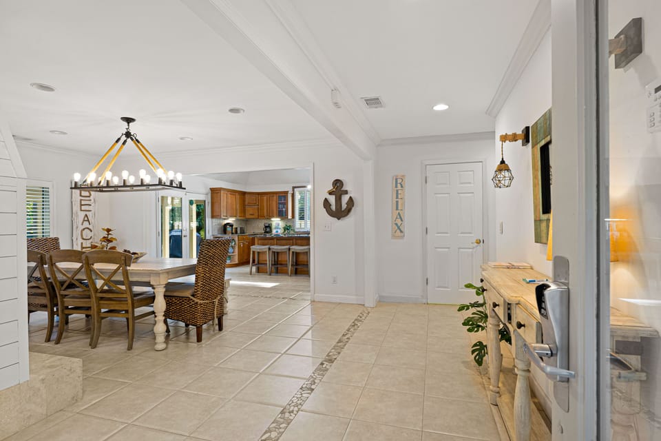 A charming coastal walkway leads to your island retreat, complete with beachy details.