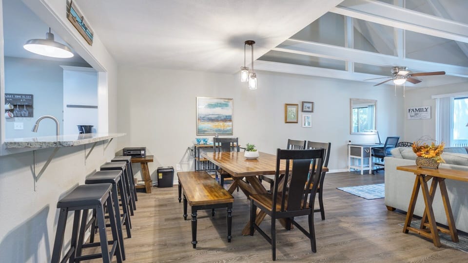 The dining area sits comfortably between the kitchen and living space, making it easy to gather, serve, and stay connected