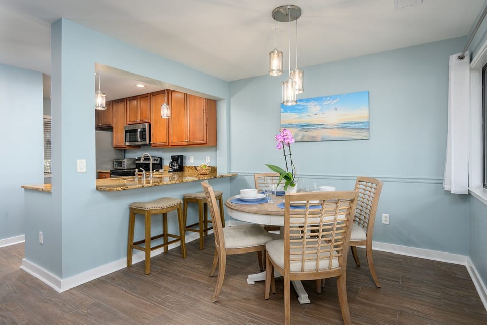Stainless steel appliances—including a full-size refrigerator, range, and microwave—make meal prep easy, while ample counter space and storage support.