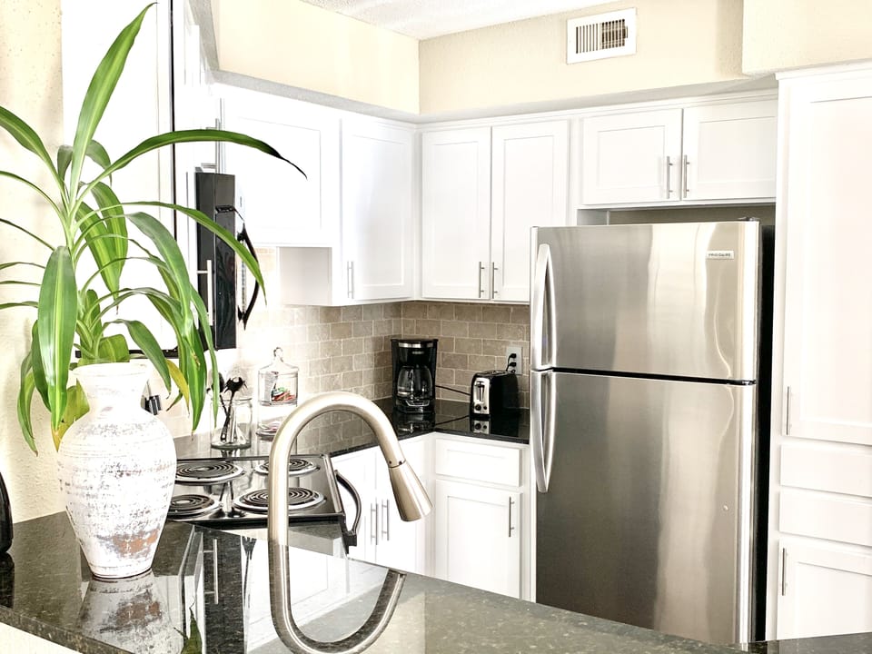 Kitchen, Granite counters, stainless steel appliances.