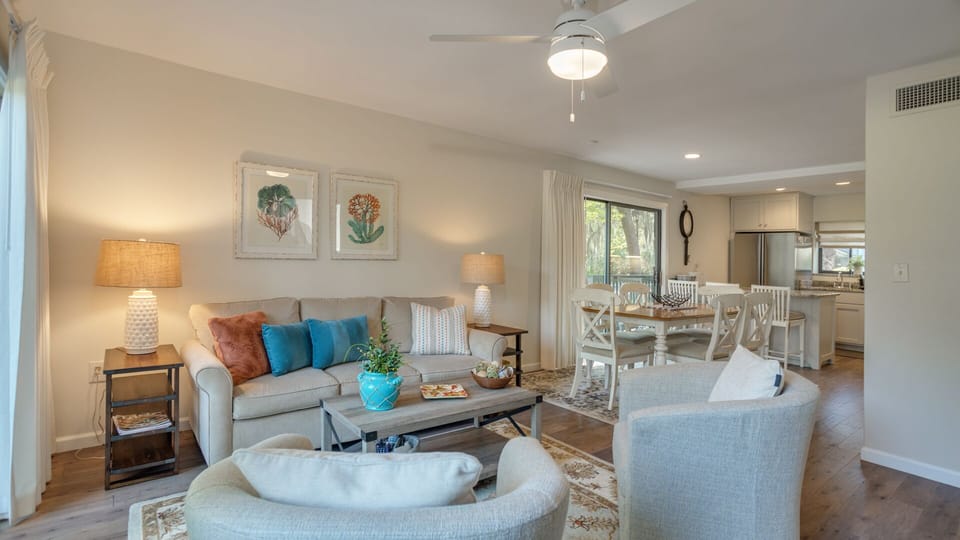 This bright, open living space blends comfort and function with an easy coastal feel.