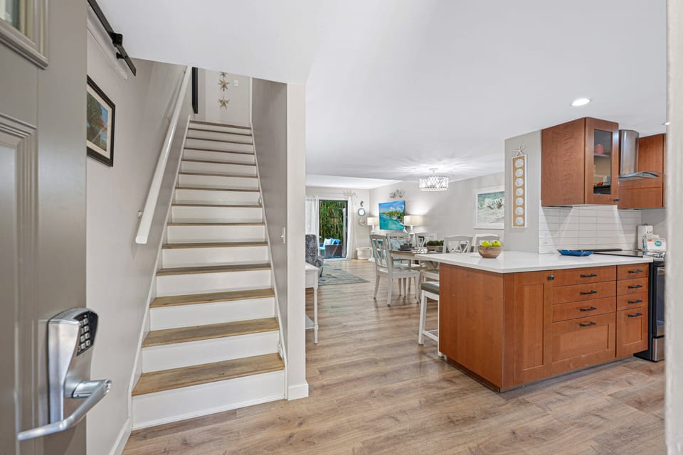From the moment you arrive, this thoughtfully updated villa welcomes you with a bright, open layout and coastal-inspired design.