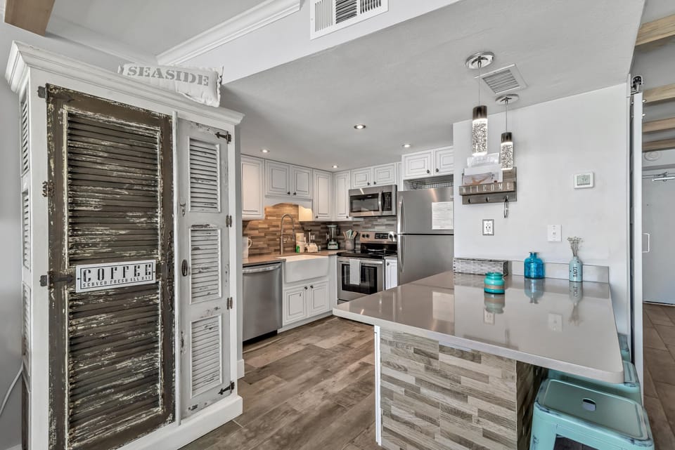 Beautifully Upgraded Spacious Kitchen with Quartz Countertops and Stainless Steel Appliances