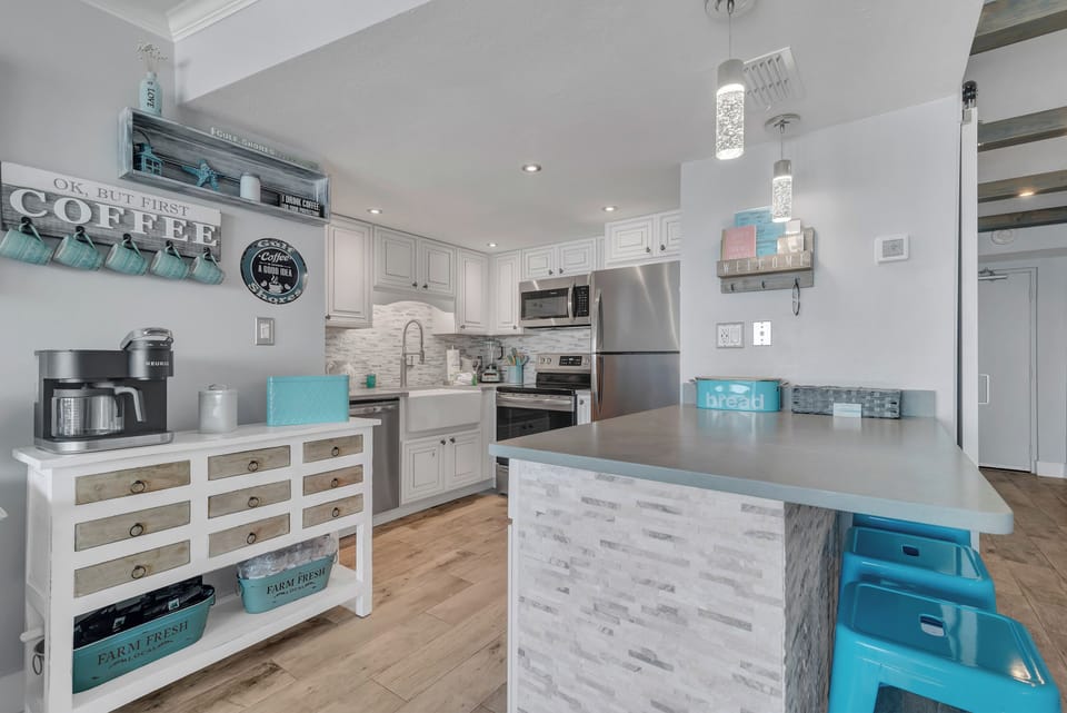 Fully Equipped Upgraded Kitchen with Quartz Countertops, Stainless Steel Appliances and a Coffee Stand!