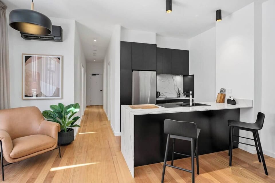 The kitchen's modern design blends style with functionality, offering everything you need to dine in comfort.

