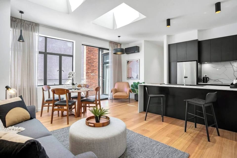 Unleash your inner chef in this sleek, fully equipped kitchen. High-end appliances and elegant countertops make meal preparation a breeze, whether you're cooking a gourmet dinner or a quick snack. 