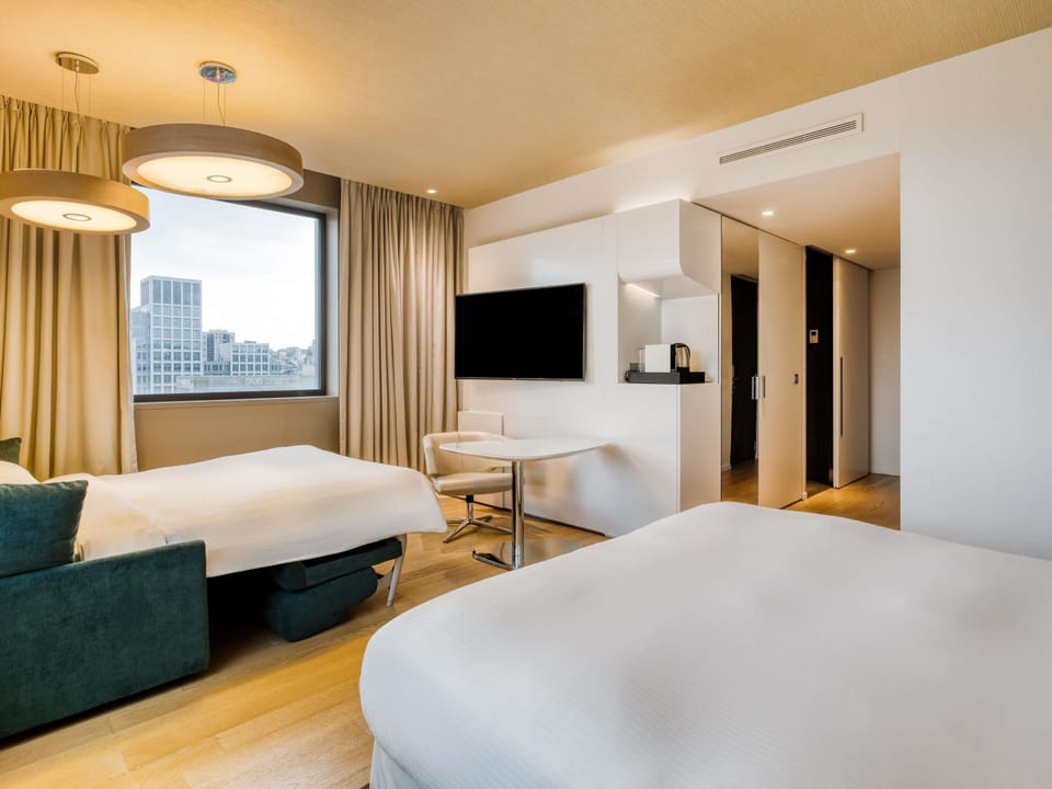 Family Room, 1 King Bed with Sofa bed, City View | Free minibar, in-room safe, desk, blackout drapes