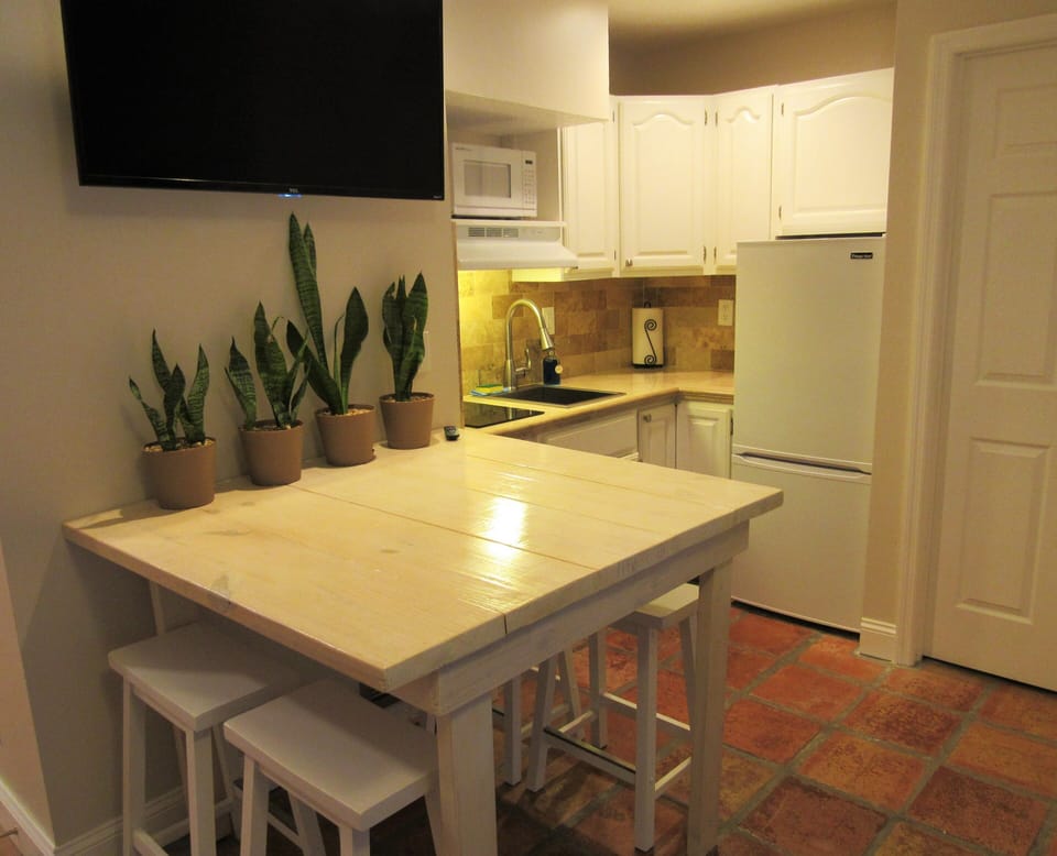 Well-stocked kitchenette and dining area for convenience and comfort.