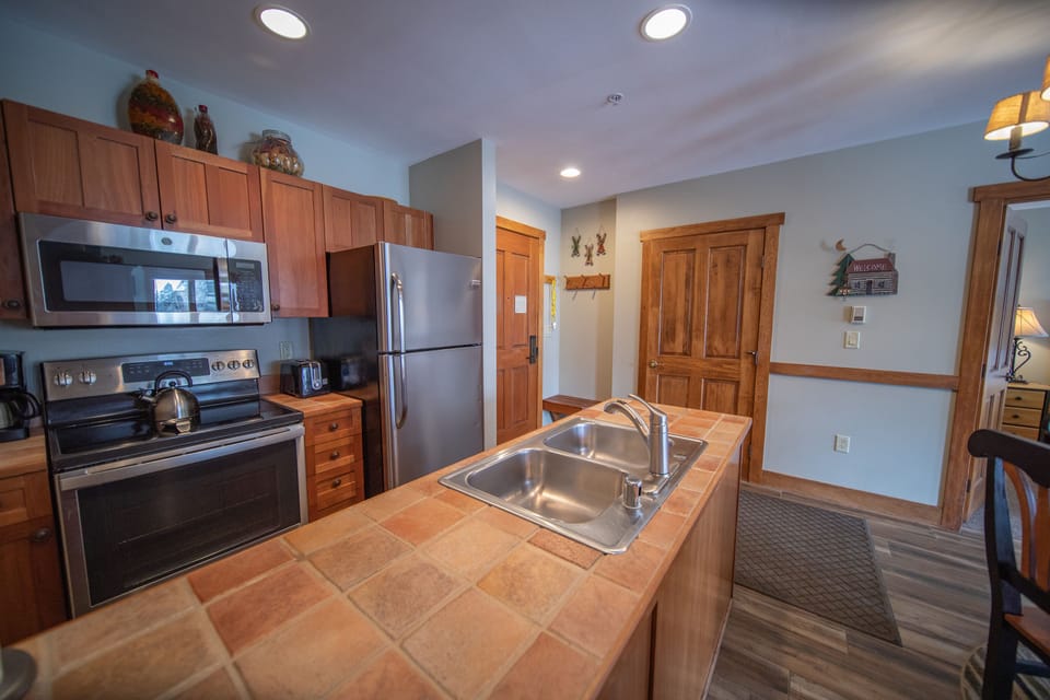 Kitchen, front door and Guest bathroom