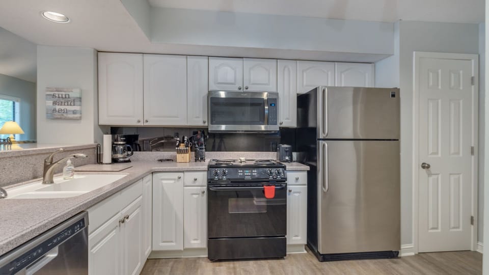 Bright kitchen with modern appliances and plenty of cabinet space.